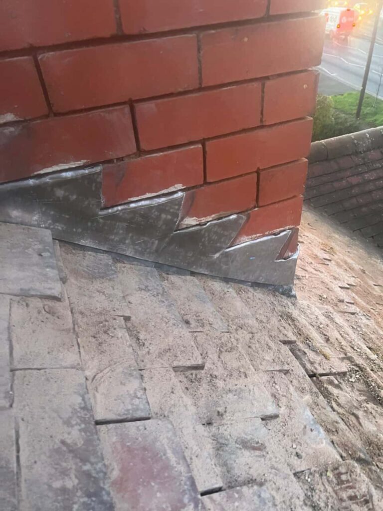 This is a photo of new leadwork being installed around an old chimney. Works carried out by Selsey Roofing Repairs